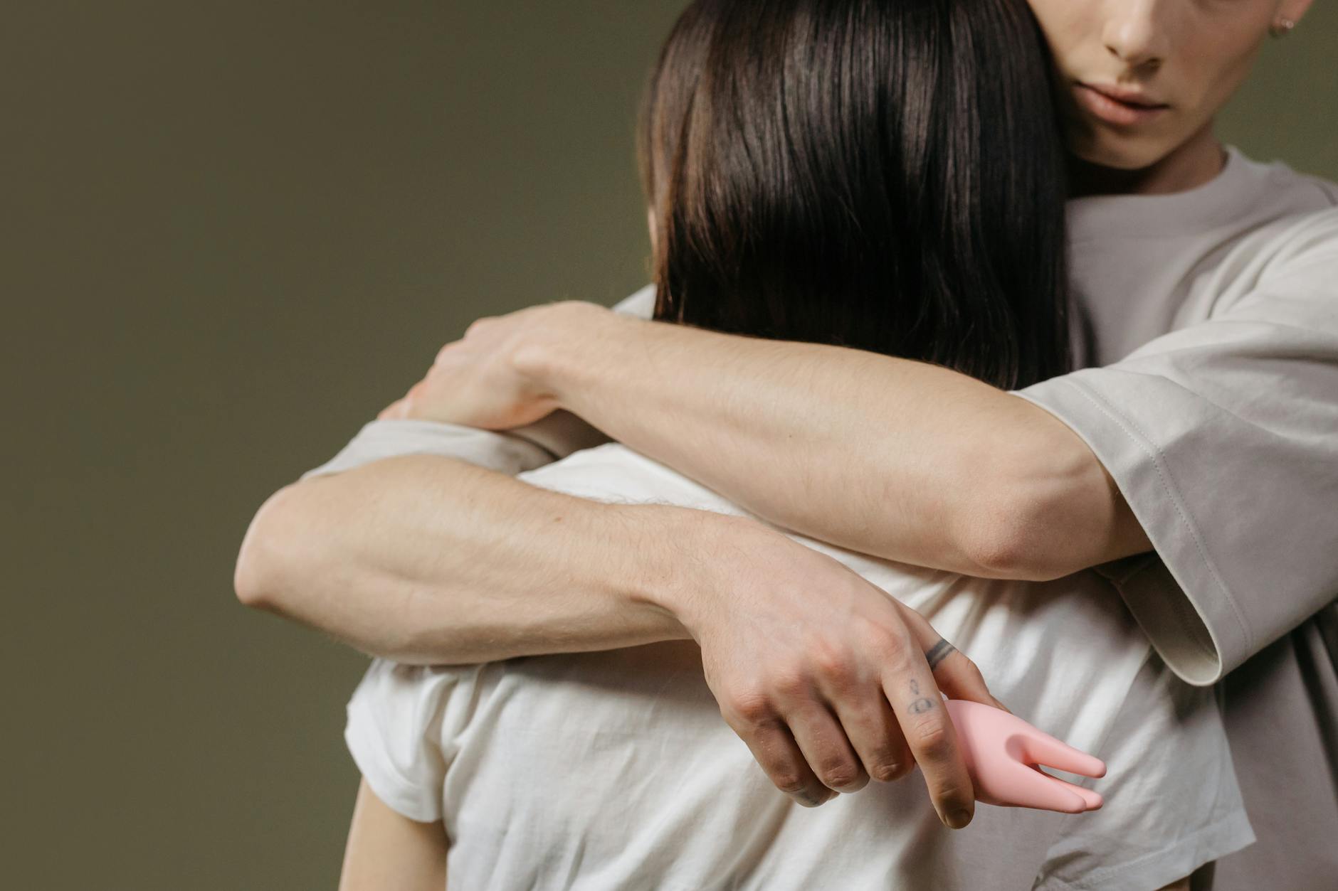 Close-up of a couple embracing, highlighting emotional intimacy and connection without performance pressure.