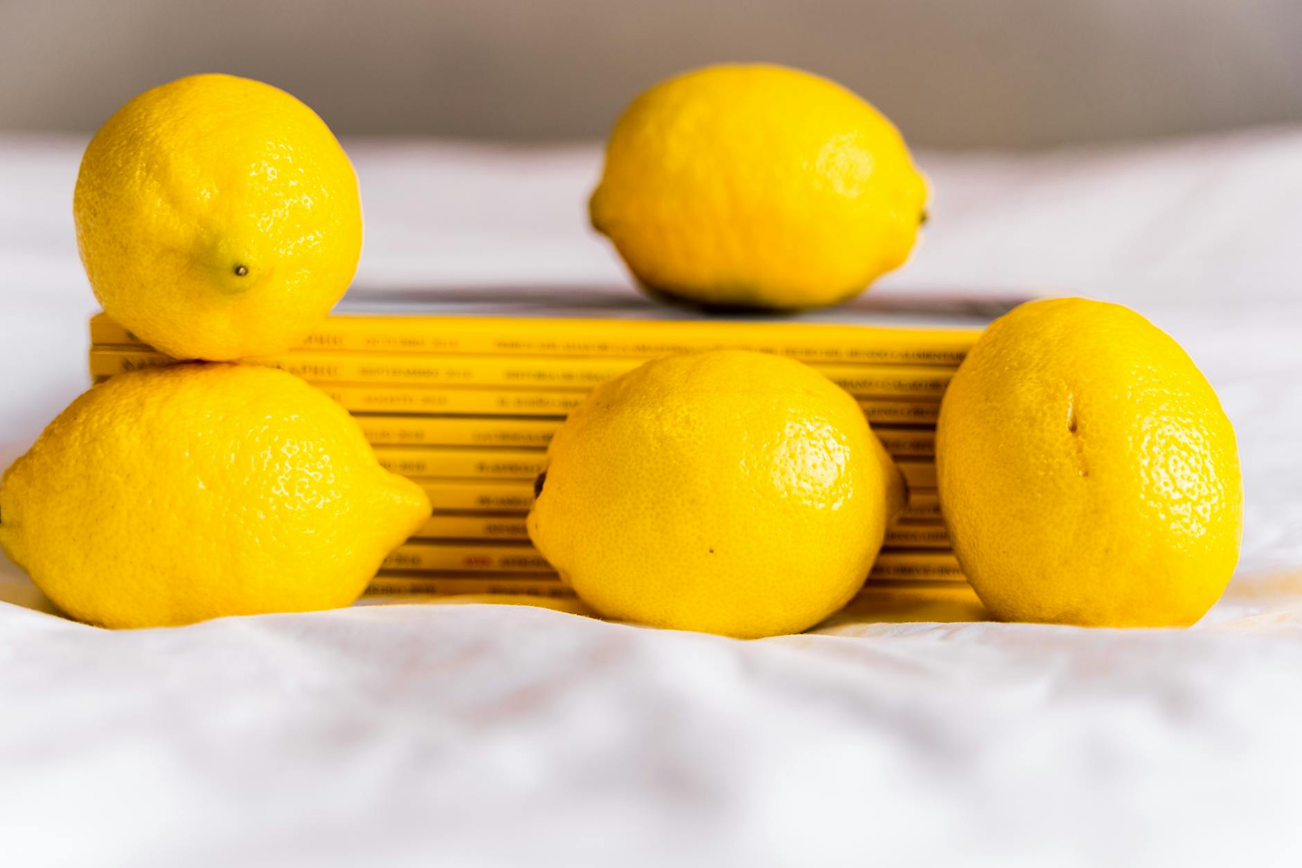 Colorful clitoral vibrators arranged on a bright yellow background in studio lighting